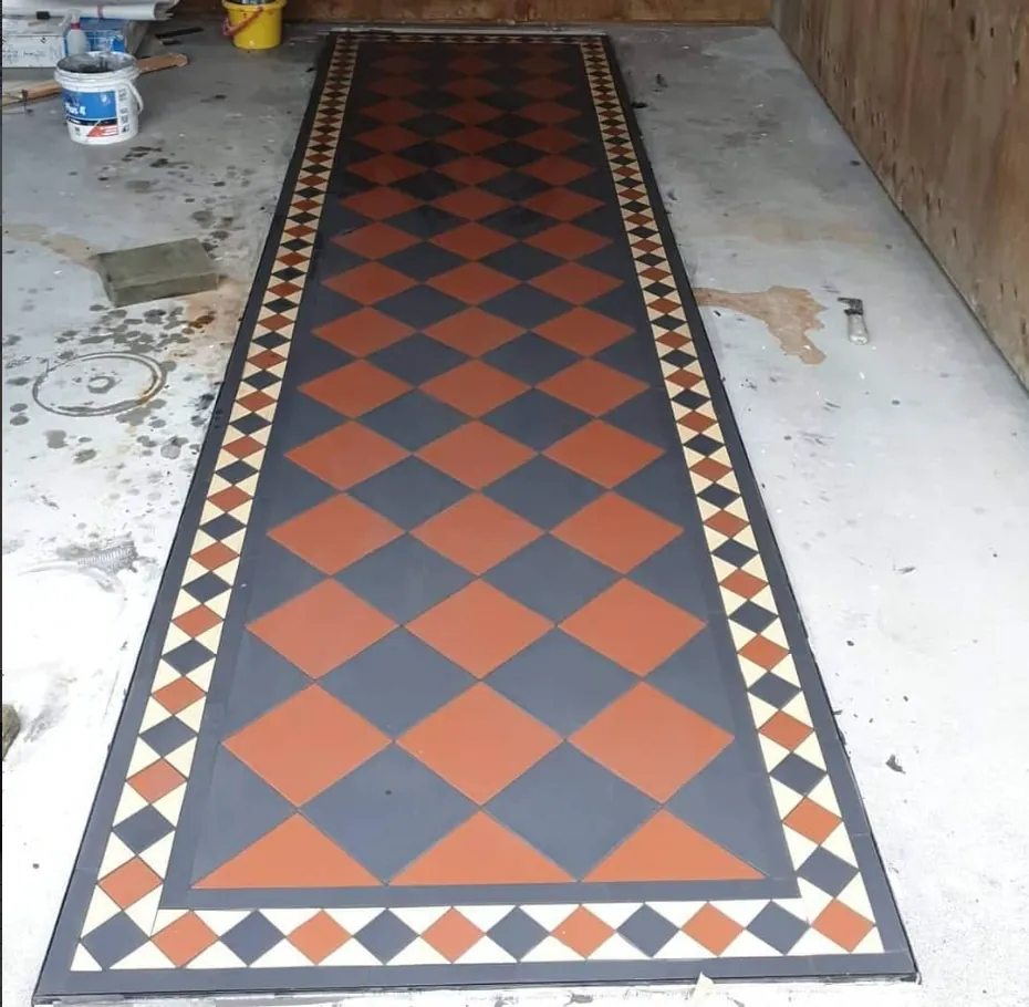 geometric floor tiles terracotta grey diamond pattern border dakom tiling auckland